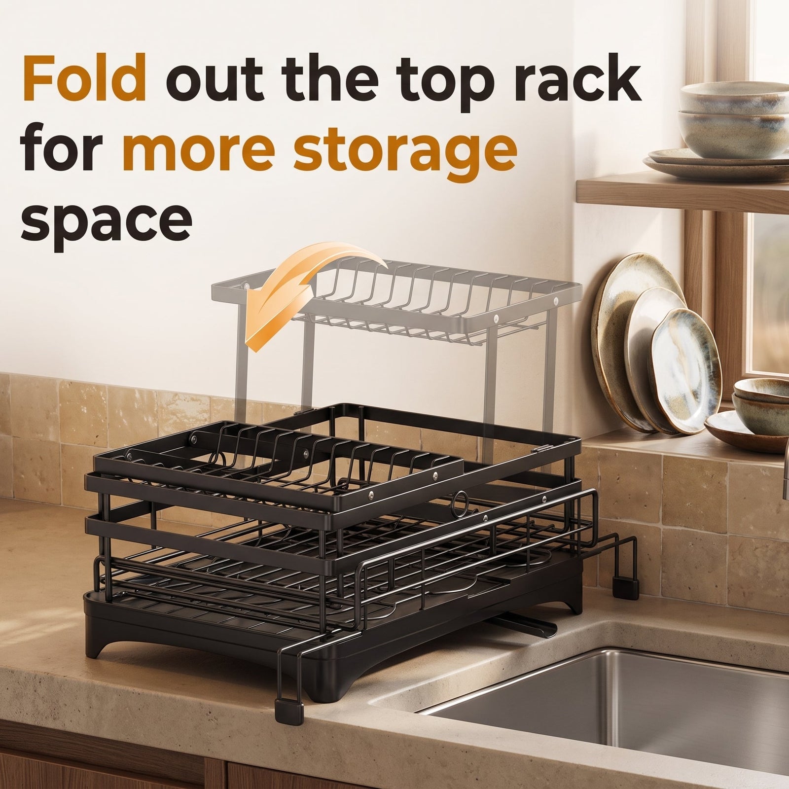 A black fold-out kitchen dish rack shown on a kitchen counter beside a sink, with overlaid text reading 'Fold out the top rack for more storage space' and a faint illustration of the extended rack.